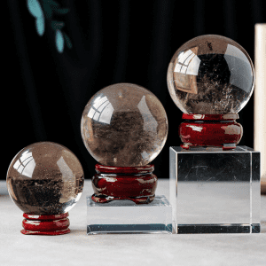 Polished smoky quartz sphere for home and office display