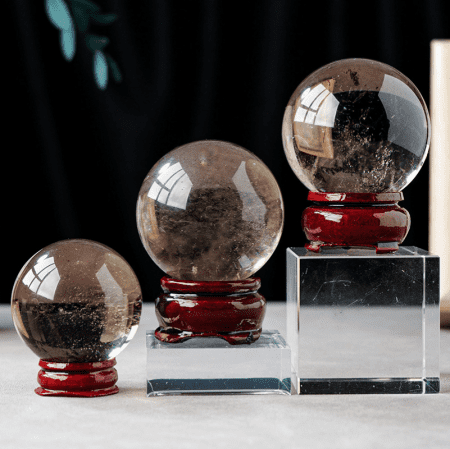 Polished smoky quartz sphere for home and office display