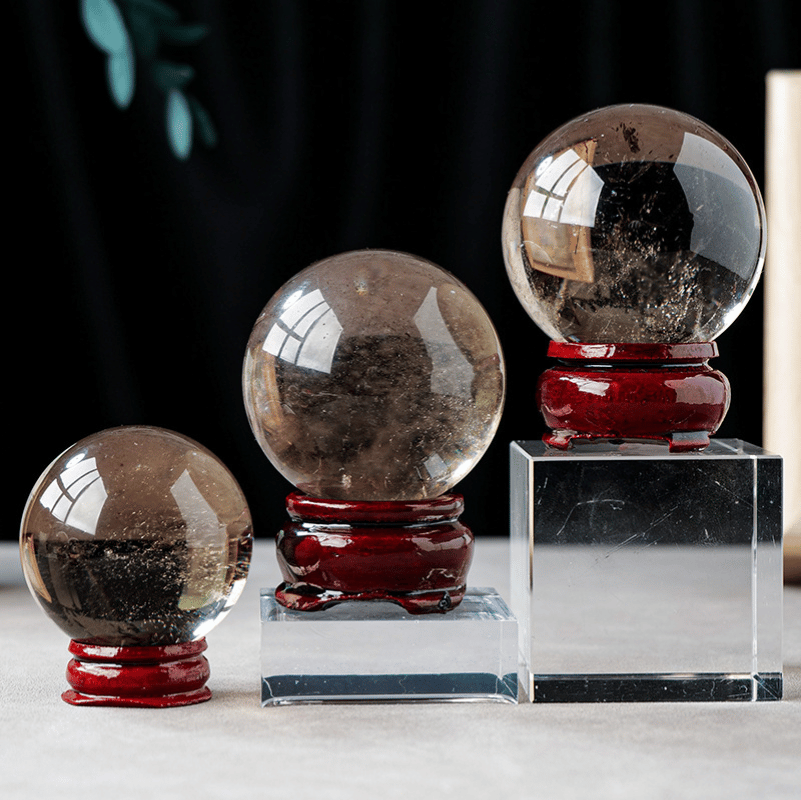 Polished smoky quartz sphere for home and office display